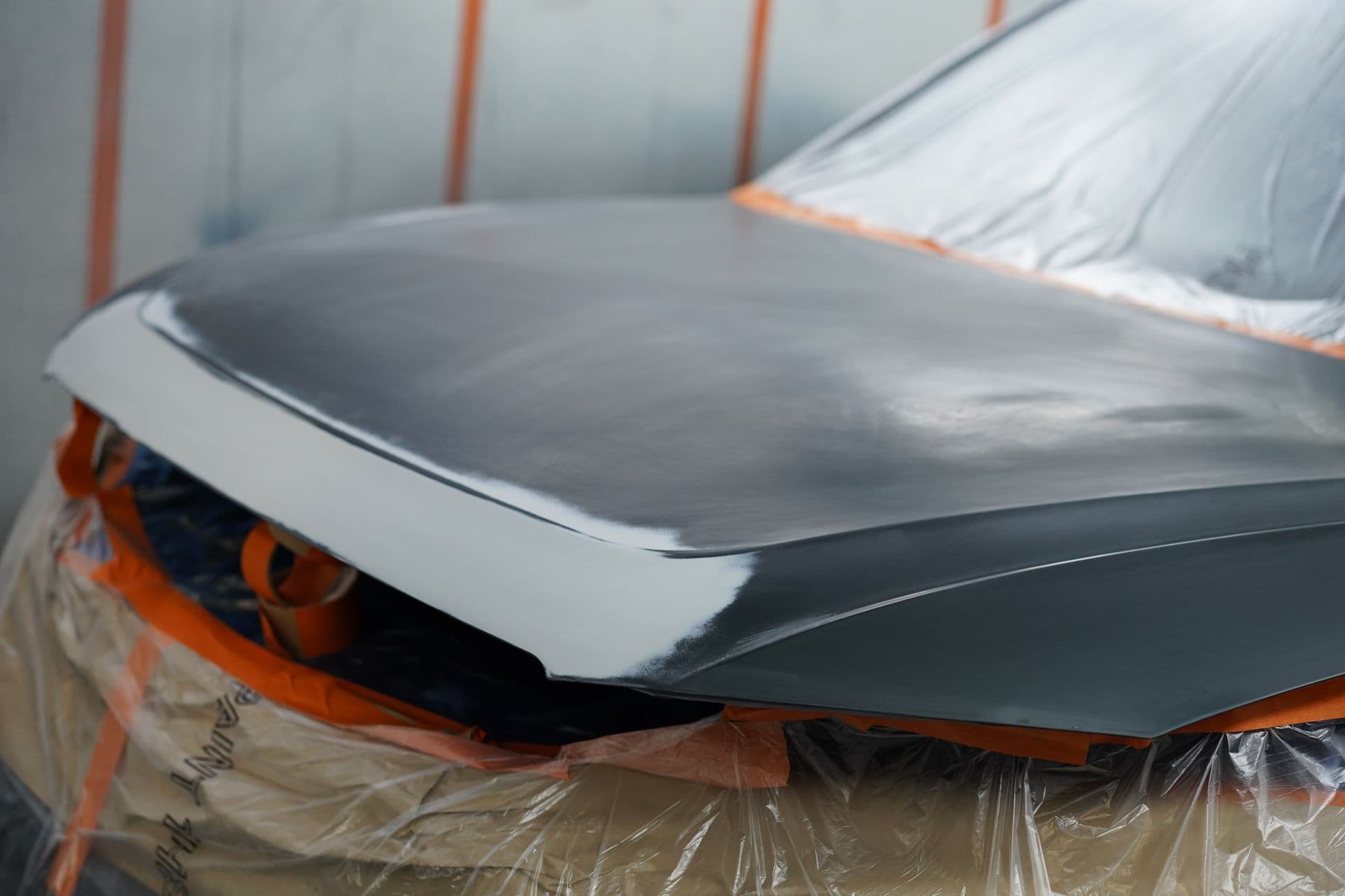 Bonnet masked and primed for paint in the spray booth