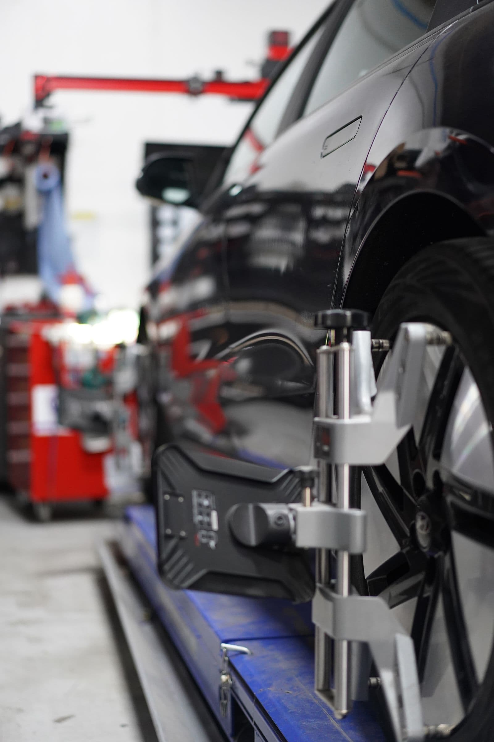 Car on the alignment rack at Solis Panelbeaters in New Lynn