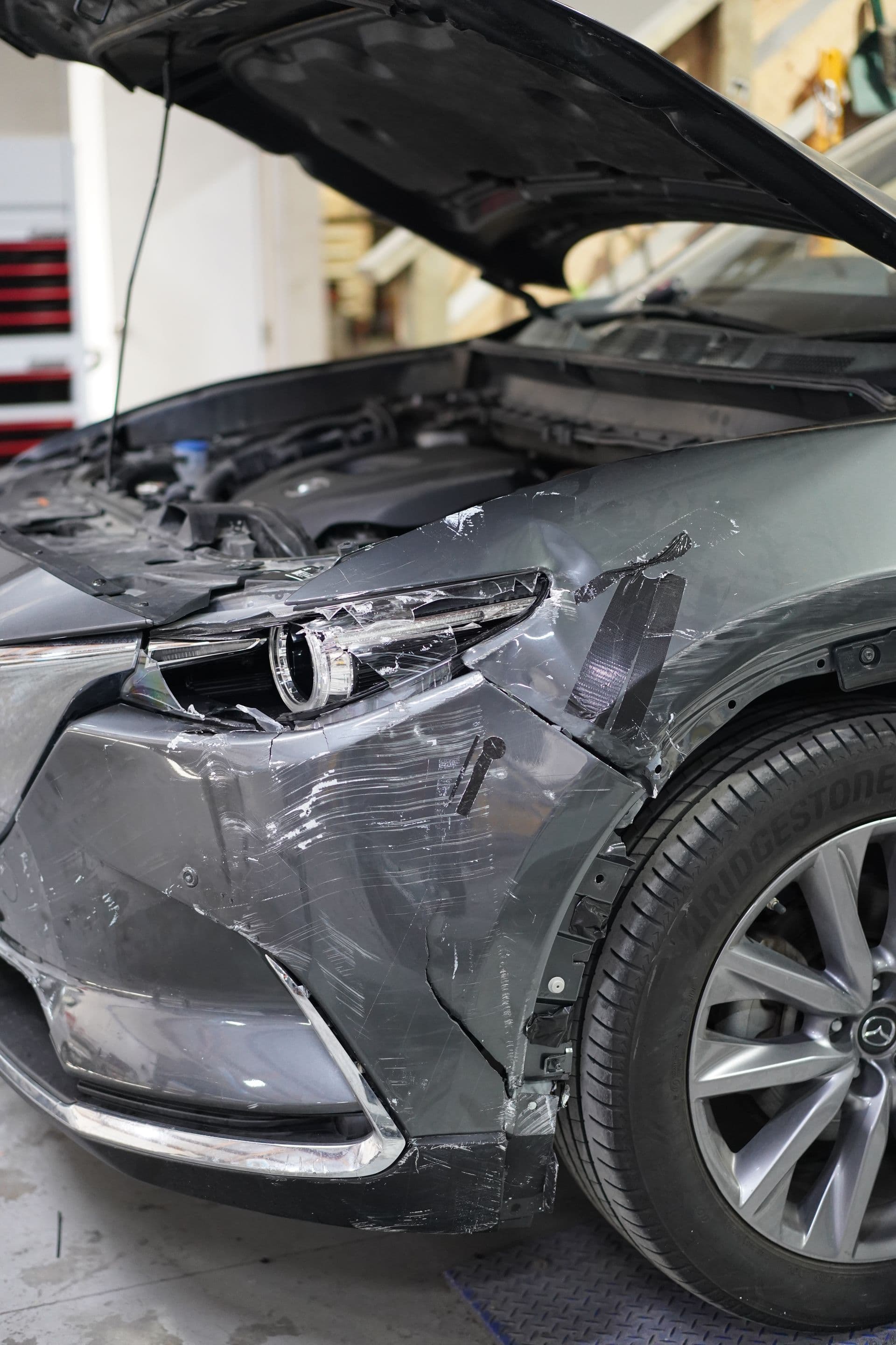 Severe collision damage on an SUV before repair at Solis